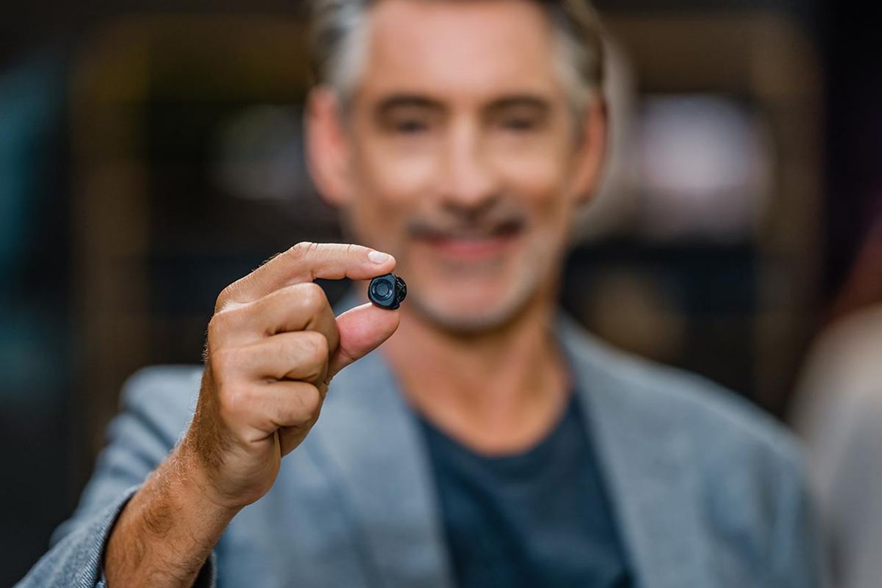 Man holding a custom hearing aid
