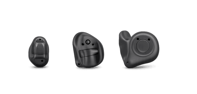 Three black custom hearing aids in different styles