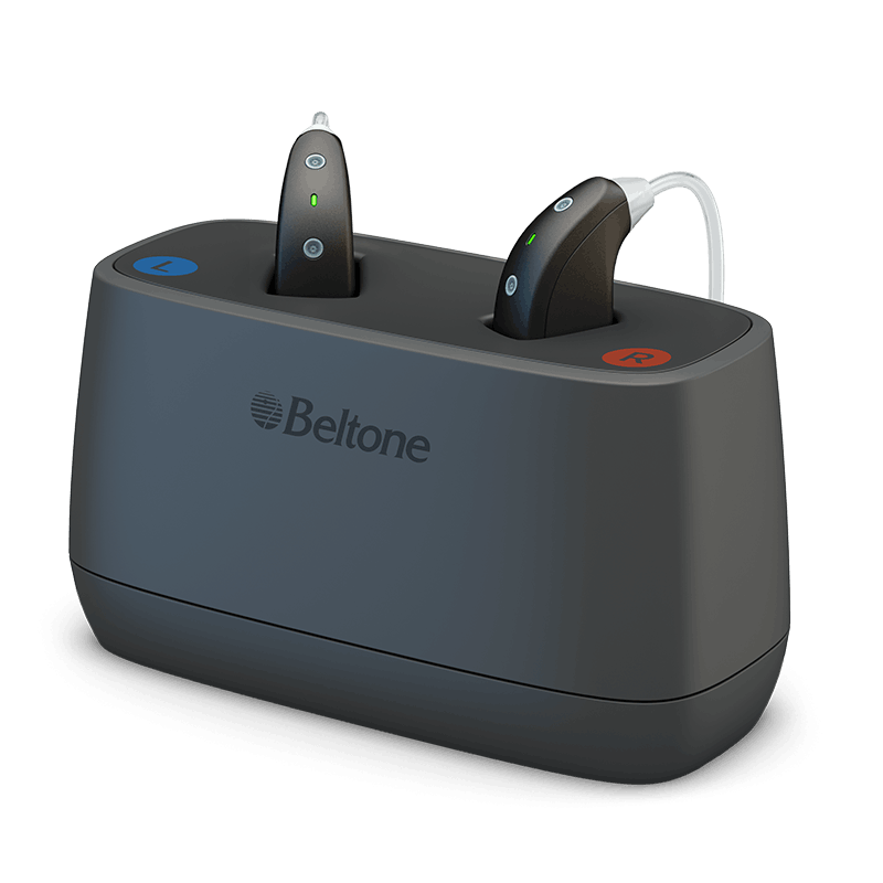 Beltone Imagine Behind-the-Ear (BTE) hearing aids placed in a Desktop charger