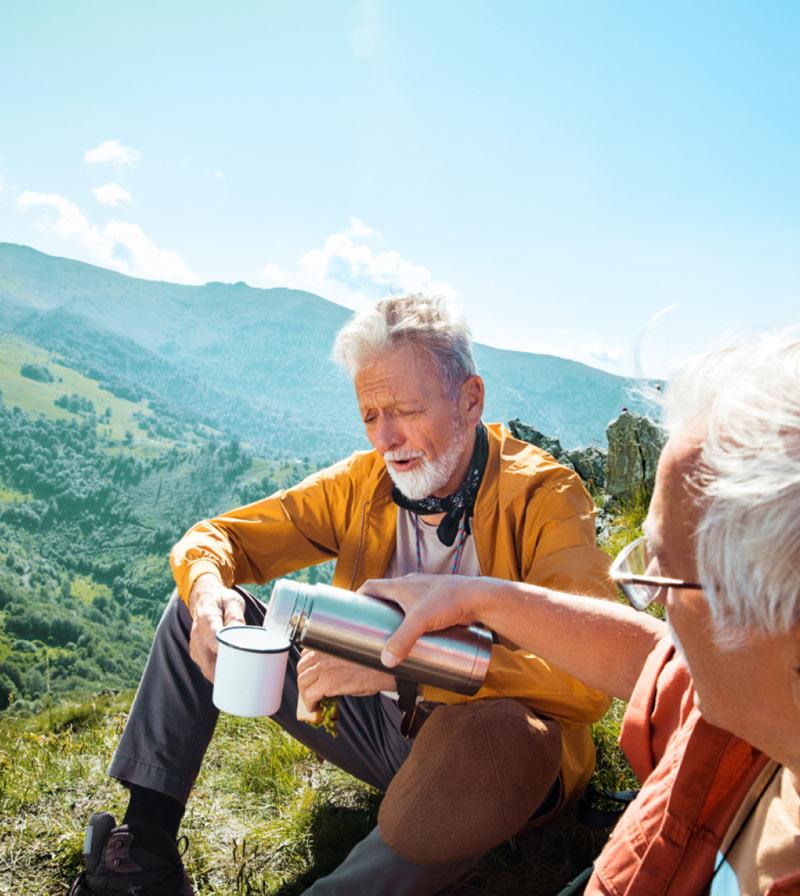 Men wearing the essential hearing aids and go hiking with friends